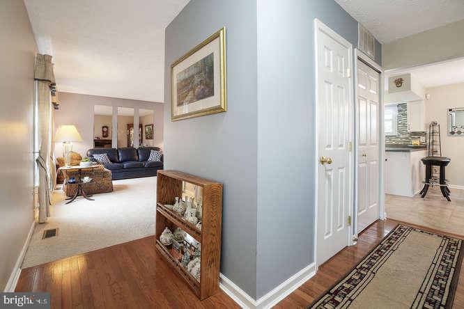 2177 Ambleside Court Frederick, MD 21702 - Photo 7 of 55 Wood entrance foyer to LR on left & kitchen to rt