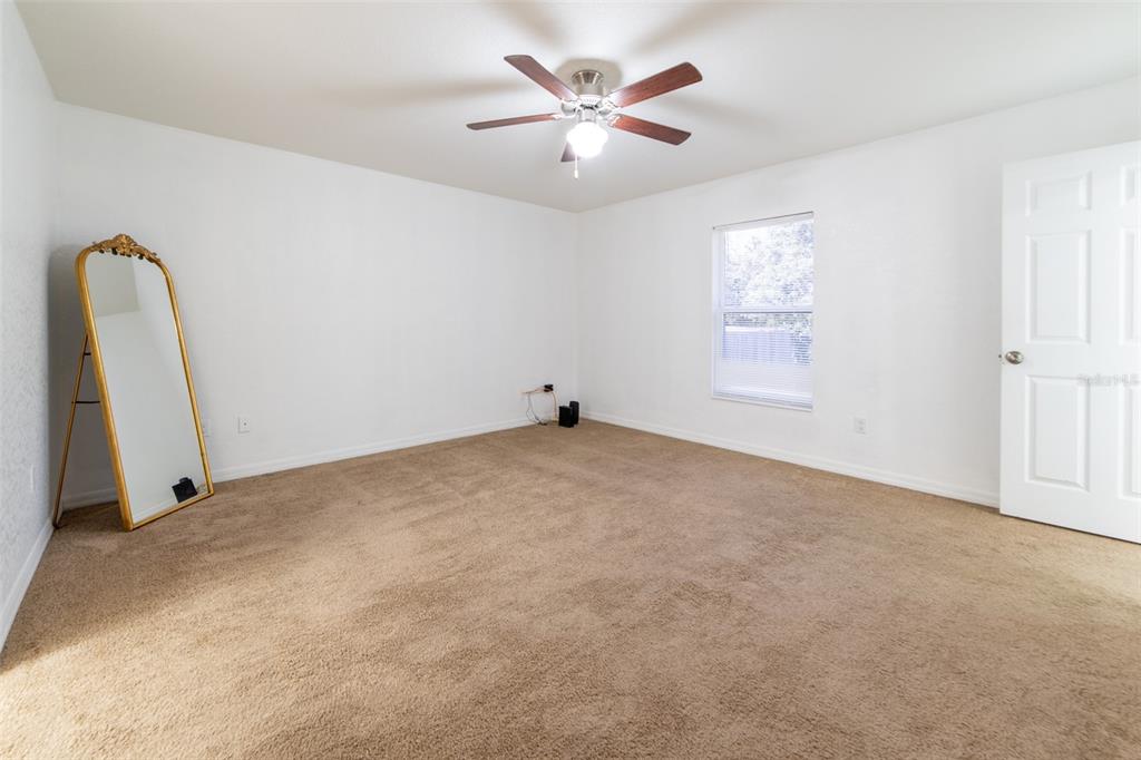 5107 Southwest 165th St Road Ocala, FL 34473 - Photo 18 of 34 a view of a room with window and ceiling fan