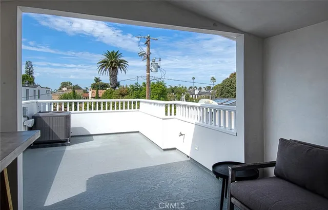 a view of balcony with furniture