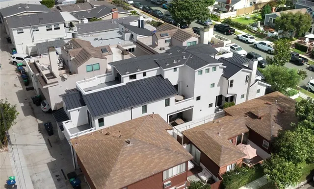 an aerial view of a residential houses with outdoor space