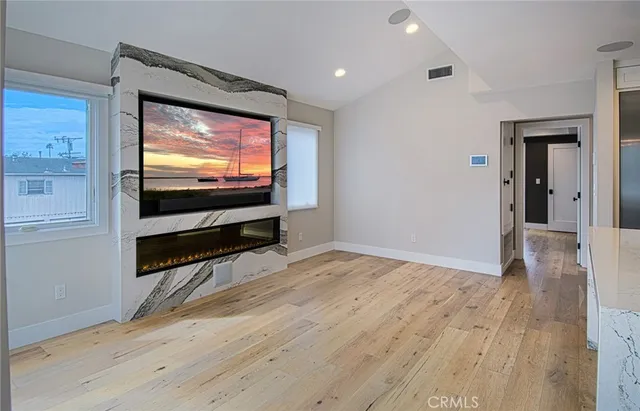 a view of livingroom with furniture and flat screen tv
