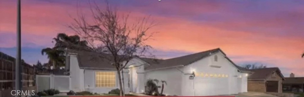 a view of a house with a tree