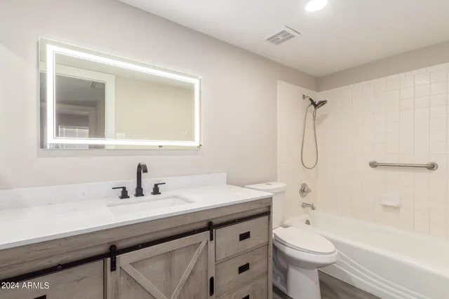 a bathroom with a toilet and a sink