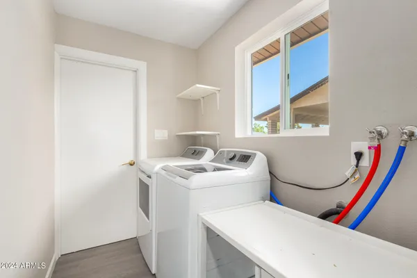 a view of a house with backyard and porch