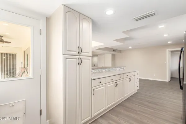 a kitchen with stainless steel appliances a stove microwave and refrigerator