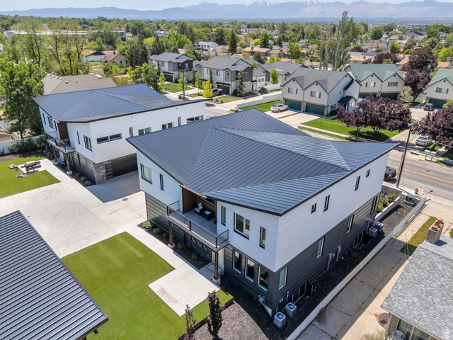 7045 South 300 East Midvale, UT 84047 - Photo 40 of 49 Modern multi-level exterior with a striking dark metal roof