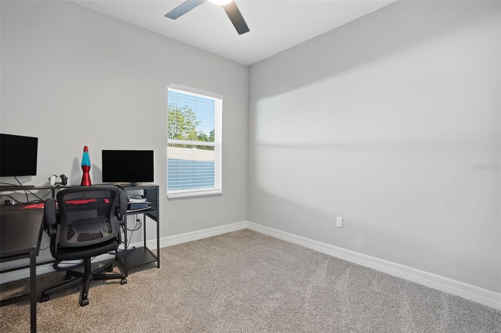 8549 Southwest 129 Lane Ocala, FL 34473 - Photo 14 of 31 a view of a workspace with a window