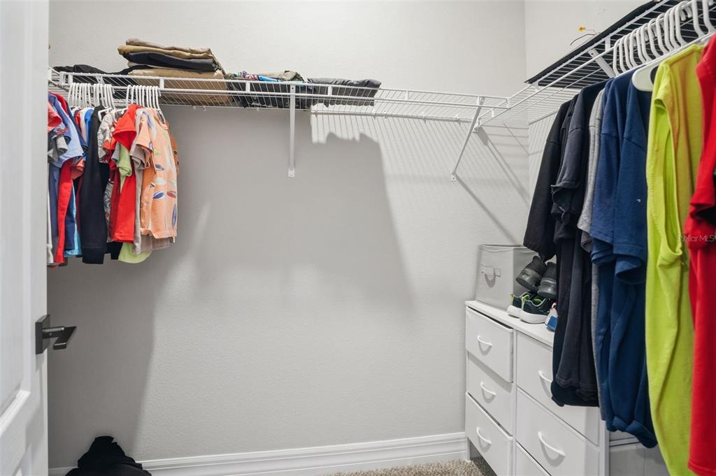 8549 Southwest 129 Lane Ocala, FL 34473 - Photo 22 of 31 a view of walk in closet with clothes and shoes