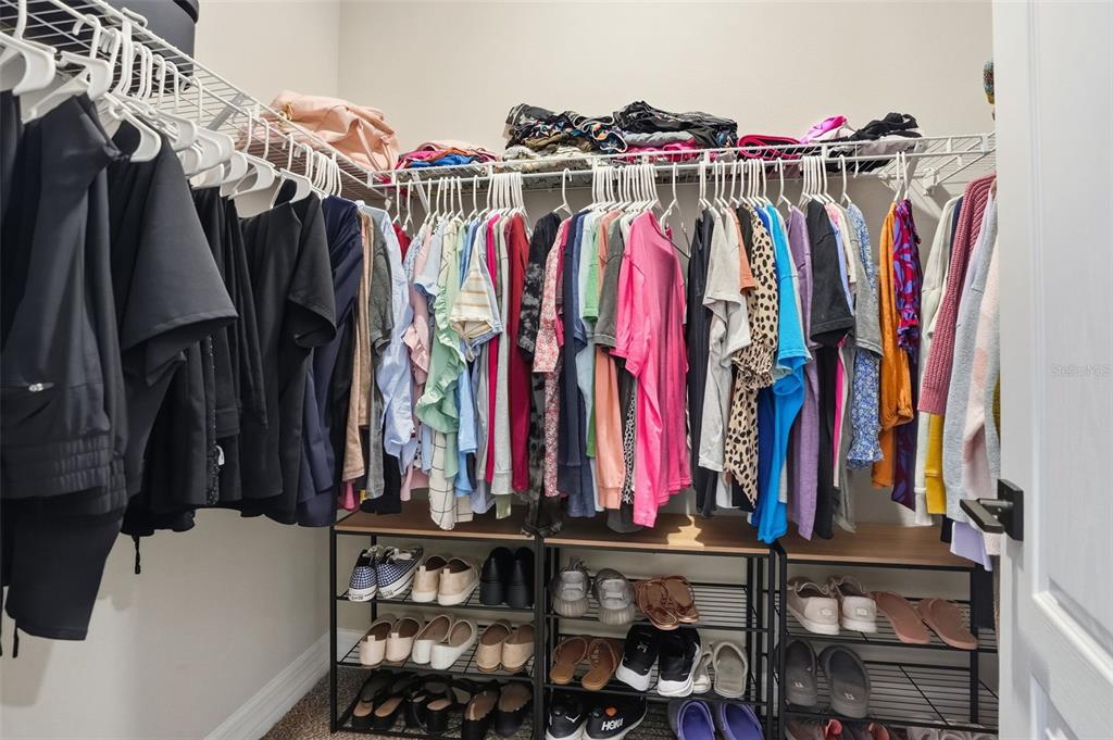 8549 Southwest 129 Lane Ocala, FL 34473 - Photo 23 of 31 a view of walk in closet with clothes