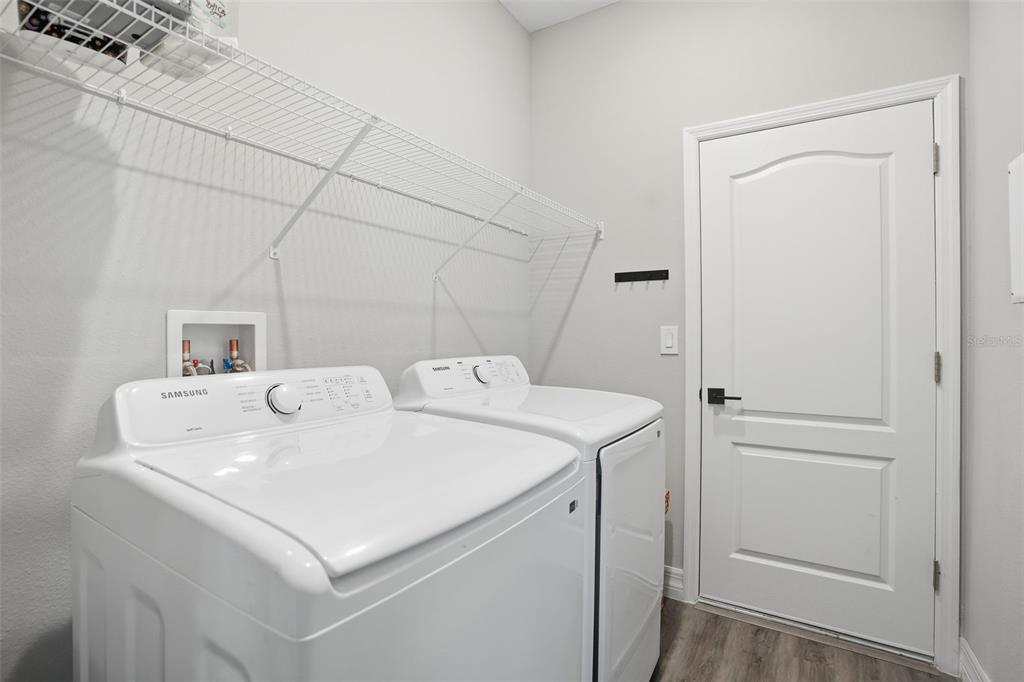 8549 Southwest 129 Lane Ocala, FL 34473 - Photo 27 of 31 a utility room with dryer and washer