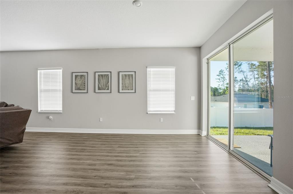 8549 Southwest 129 Lane Ocala, FL 34473 - Photo 5 of 31 a view of an empty room with glass door