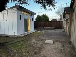 a backyard of a house with lots of green space