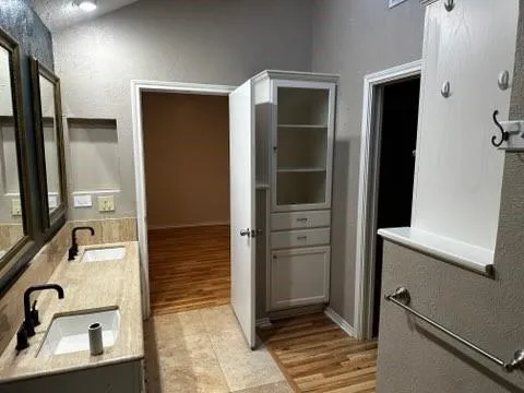 a bathroom with a sink and mirror
