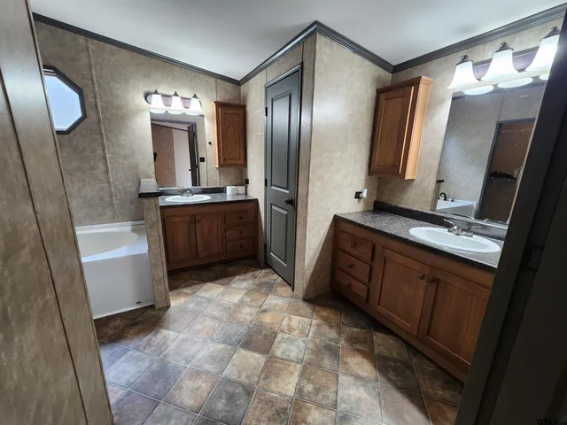 a bathroom with a bathtub and a shower
