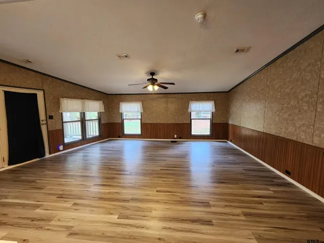 a kitchen with wooden cabinets and a stove top oven