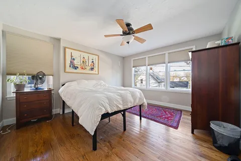 a bed room with a bed and a window