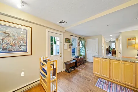 a living room with furniture and large windows