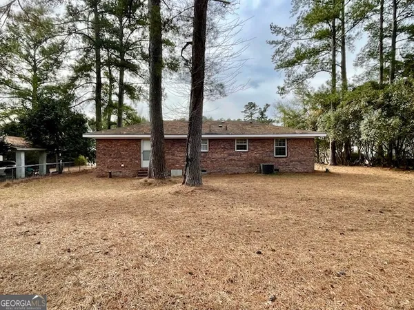 a view of outdoor space with deck and tree