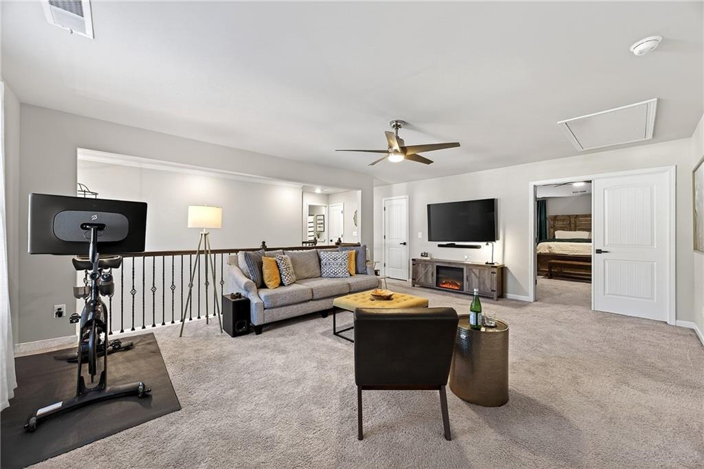 4863 Sultana Way Atlanta, GA 30331 - Photo 19 of 42 a living room with furniture and a flat screen tv