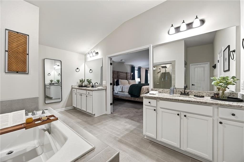 4863 Sultana Way Atlanta, GA 30331 - Photo 26 of 42 a en suite bathroom with a double vanity sink double and mirror