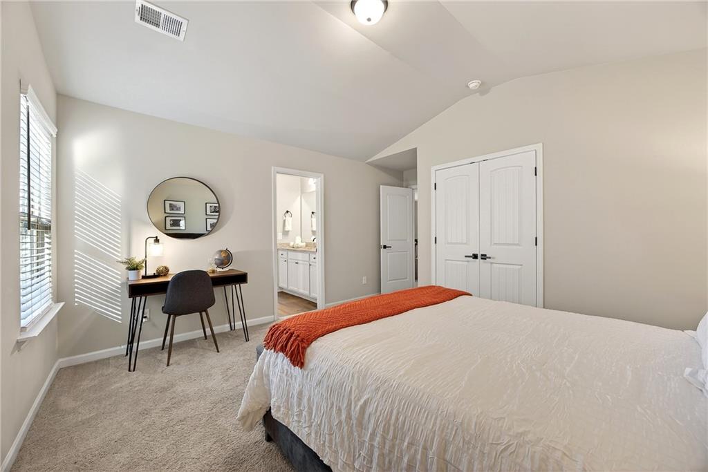 4863 Sultana Way Atlanta, GA 30331 - Photo 33 of 42 a bedroom with bed and a chandelier