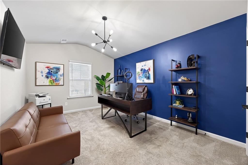 4863 Sultana Way Atlanta, GA 30331 - Photo 35 of 42 a living room with furniture and a flat screen tv