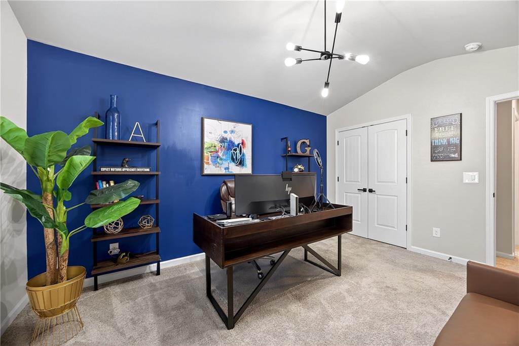 4863 Sultana Way Atlanta, GA 30331 - Photo 36 of 42 a living room with furniture a piano and a flat screen tv
