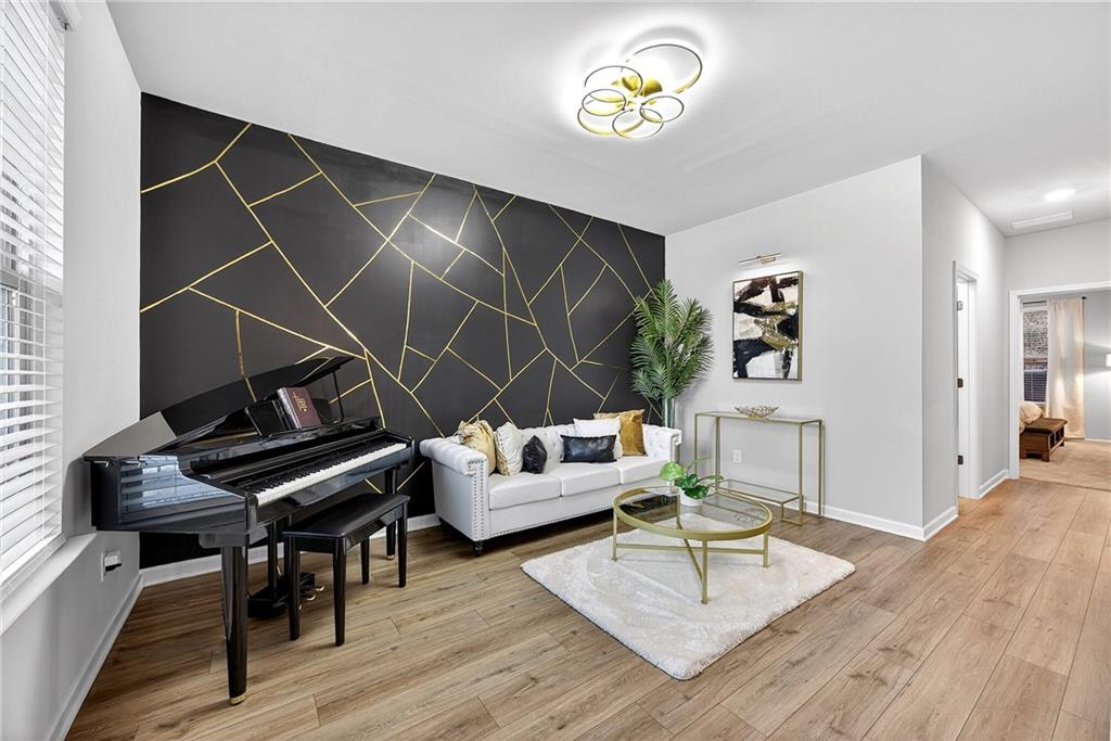 4863 Sultana Way Atlanta, GA 30331 - Photo 7 of 42 a living room with furniture and a wooden floor