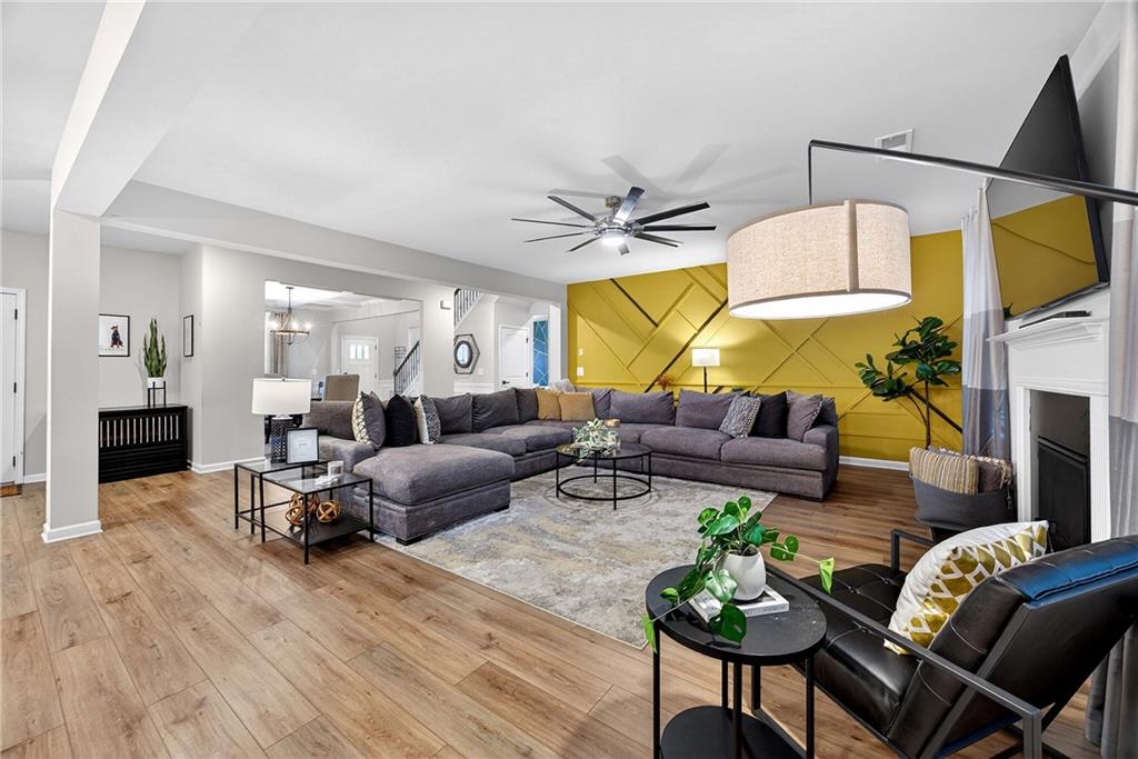 4863 Sultana Way Atlanta, GA 30331 - Photo 8 of 42 a living room with fireplace furniture and a wooden floor