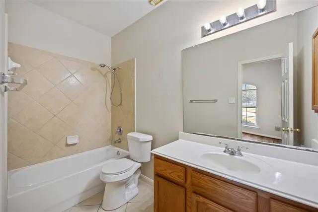 a bathroom with a sink a toilet and a bathtub