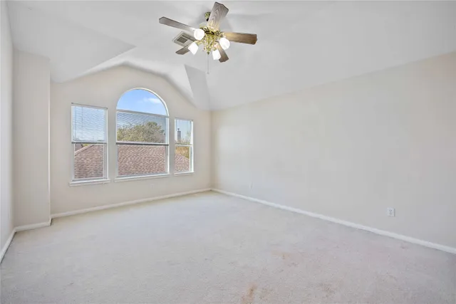 a bathroom with a sink a toilet and a large mirror