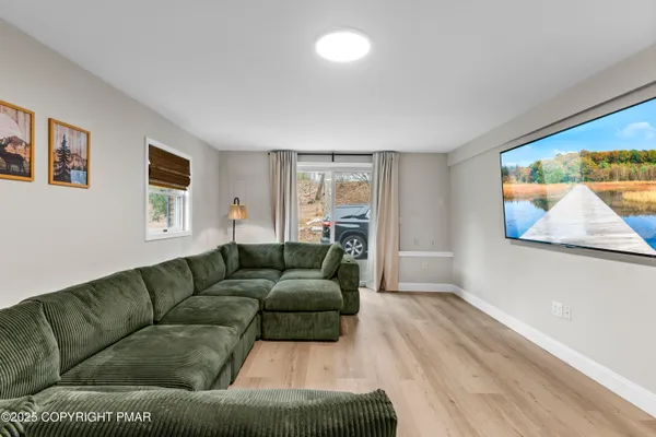 a living room with furniture and a window