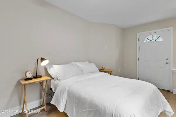 a bedroom with a bed and a table