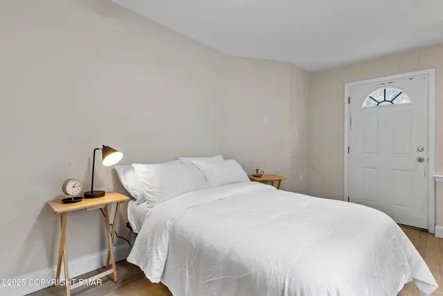 a bedroom with a bed and a table