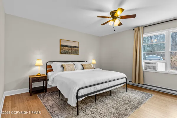 a bedroom with a bed and a window
