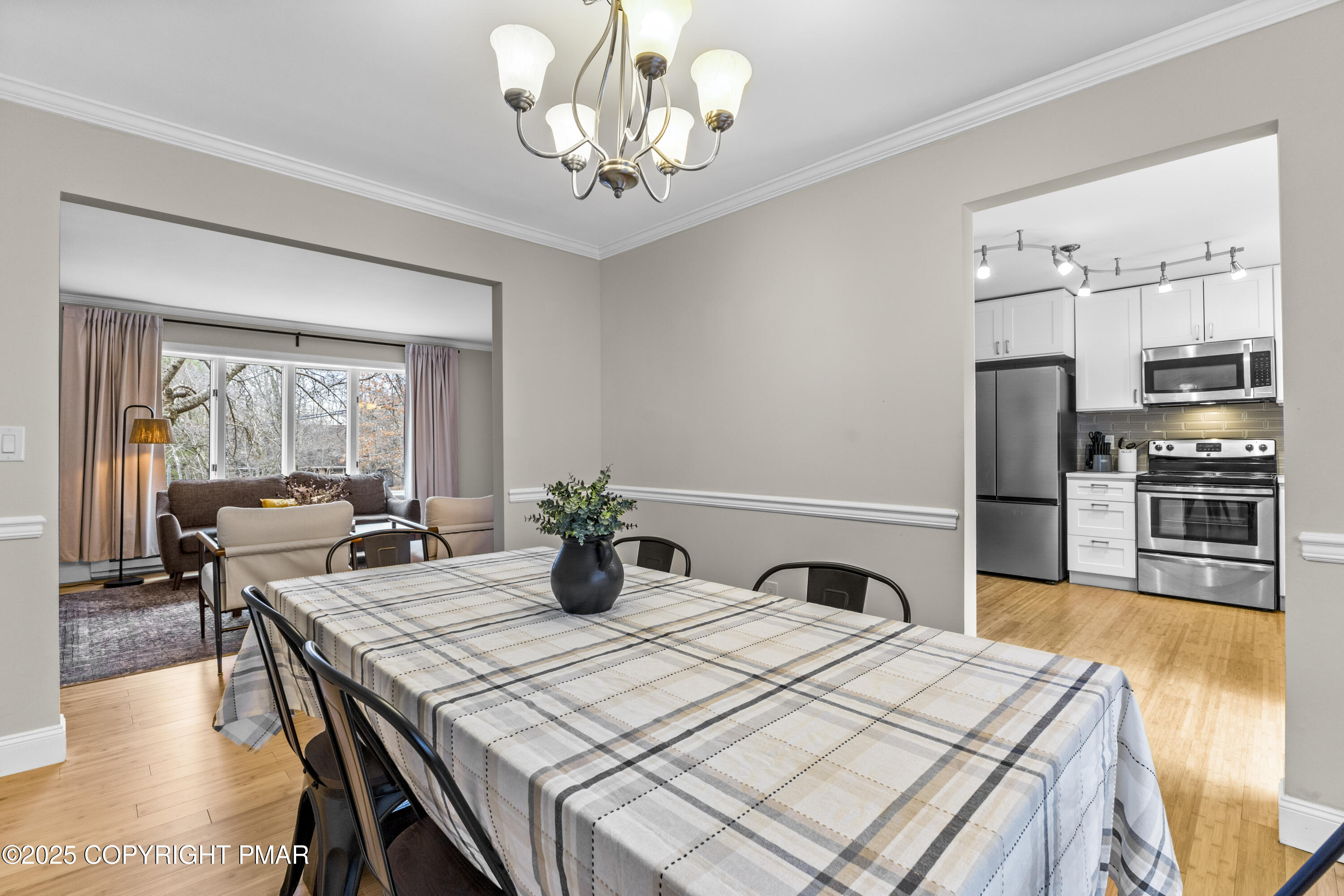 558 Clearview Drive Long Pond, PA 18334 - Photo 6 of 36 a kitchen with a table chairs stainless steel appliances and cabinets