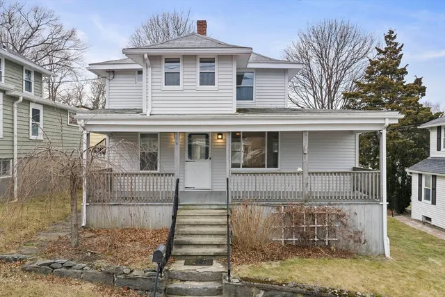 a front view of a house with a porch