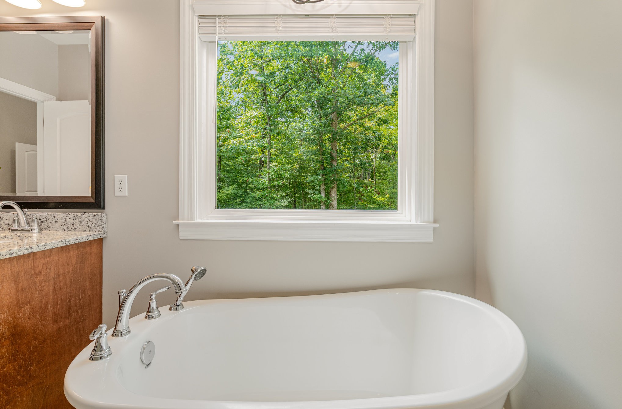 3395 Shouse Road Santa Fe, TN 38482 - Photo 15 of 73 a white bath tub sitting in a bathroom next to a window