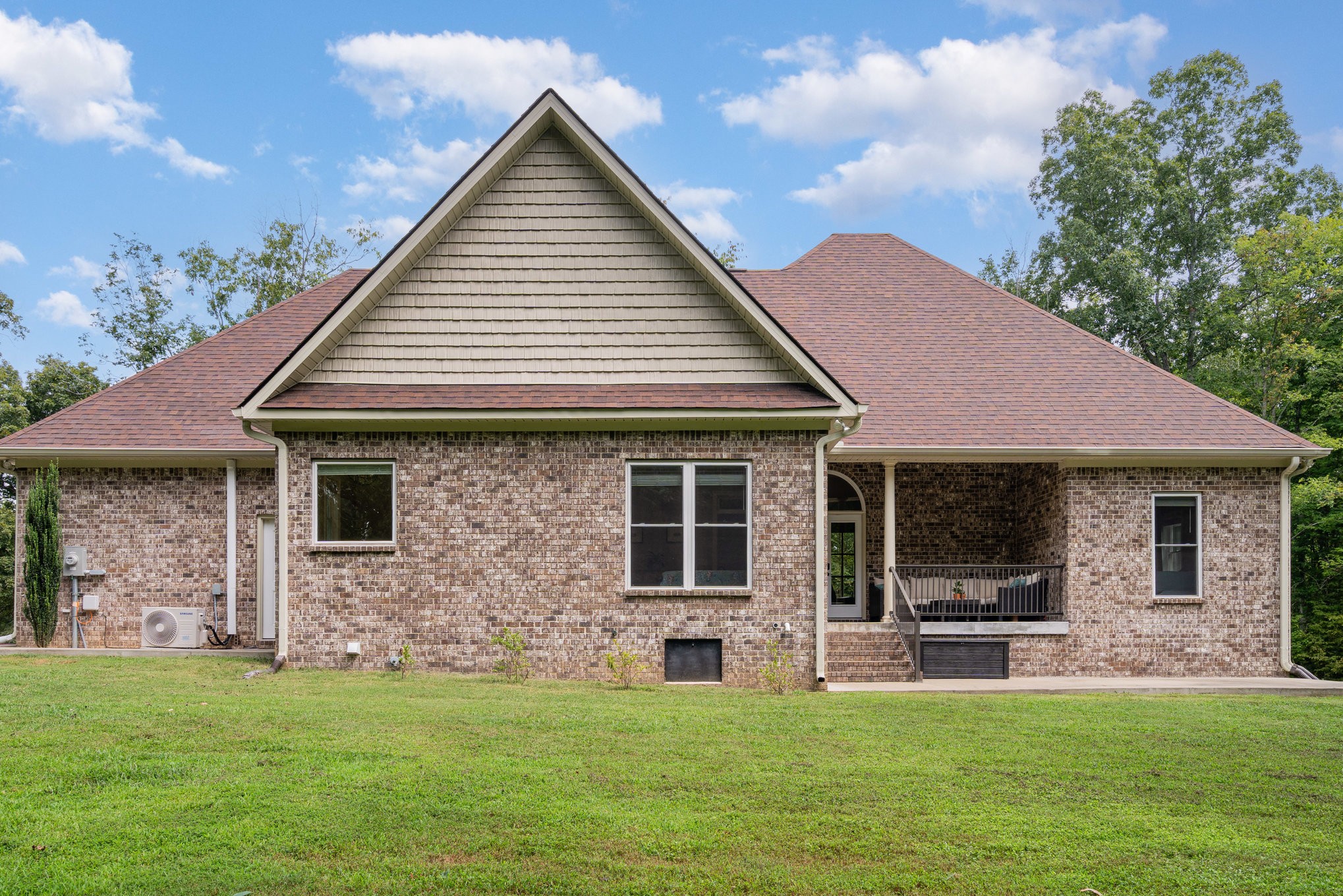 3395 Shouse Road Santa Fe, TN 38482 - Photo 23 of 73 a front view of a house with a garden
