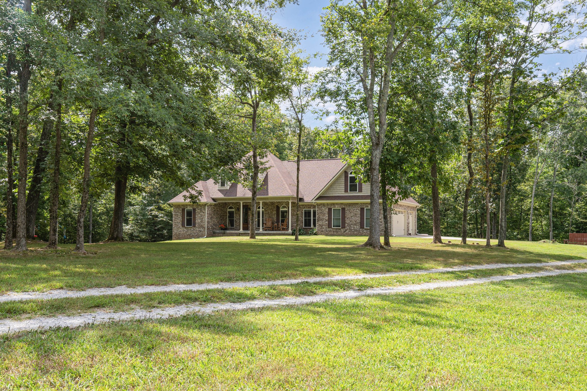 3395 Shouse Road Santa Fe, TN 38482 - Photo 3 of 73 a view of a big house in a big yard with large trees