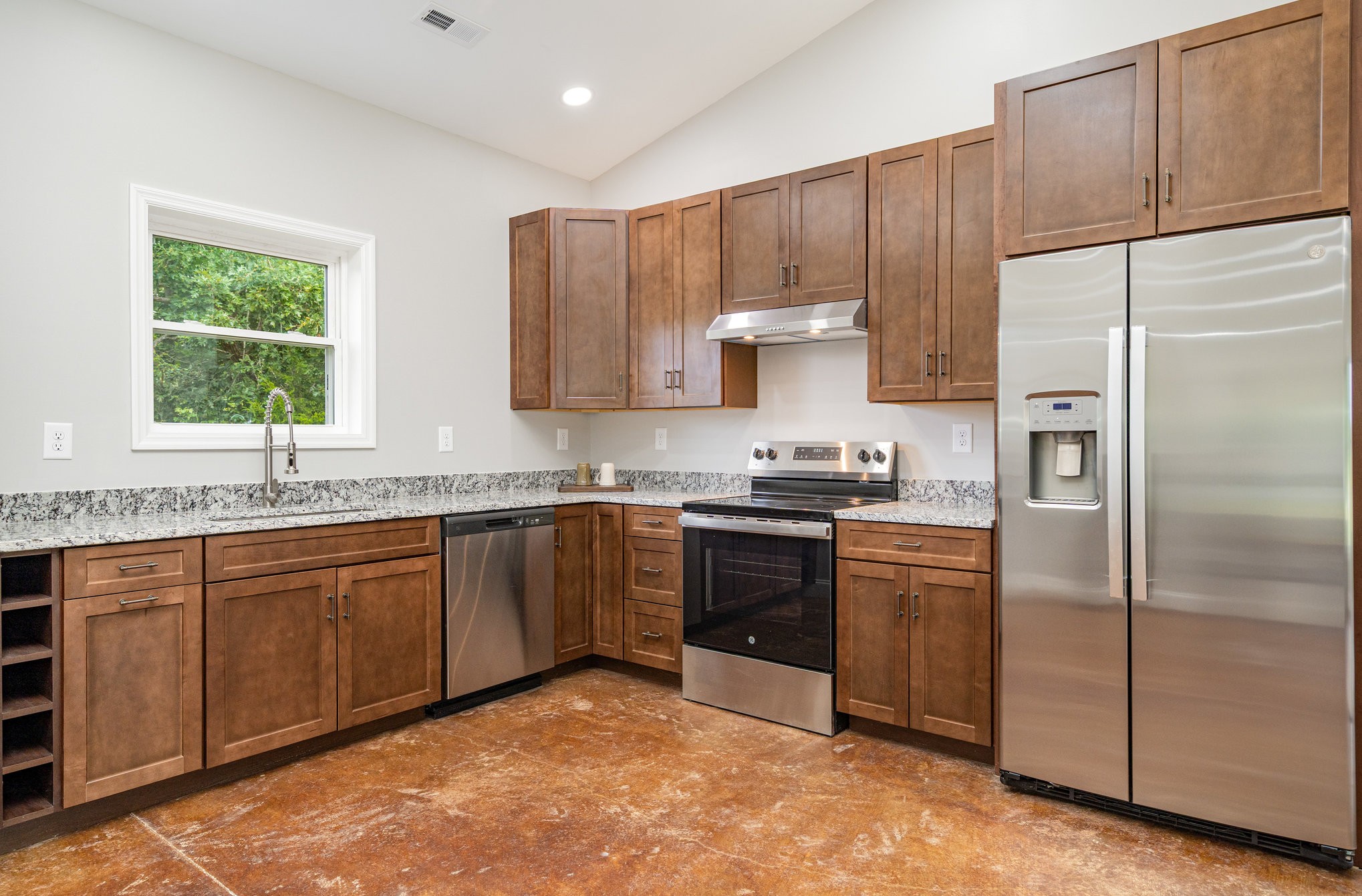 3395 Shouse Road Santa Fe, TN 38482 - Photo 36 of 73 a kitchen with stainless steel appliances granite countertop a refrigerator and a sink