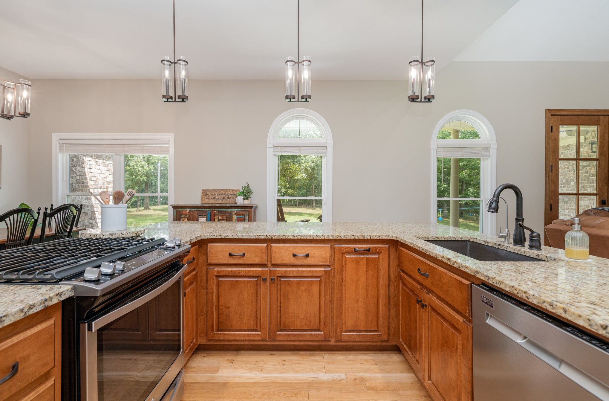 3395 Shouse Road Santa Fe, TN 38482 - Photo 9 of 73 a kitchen with stainless steel appliances granite countertop a stove a sink and a window