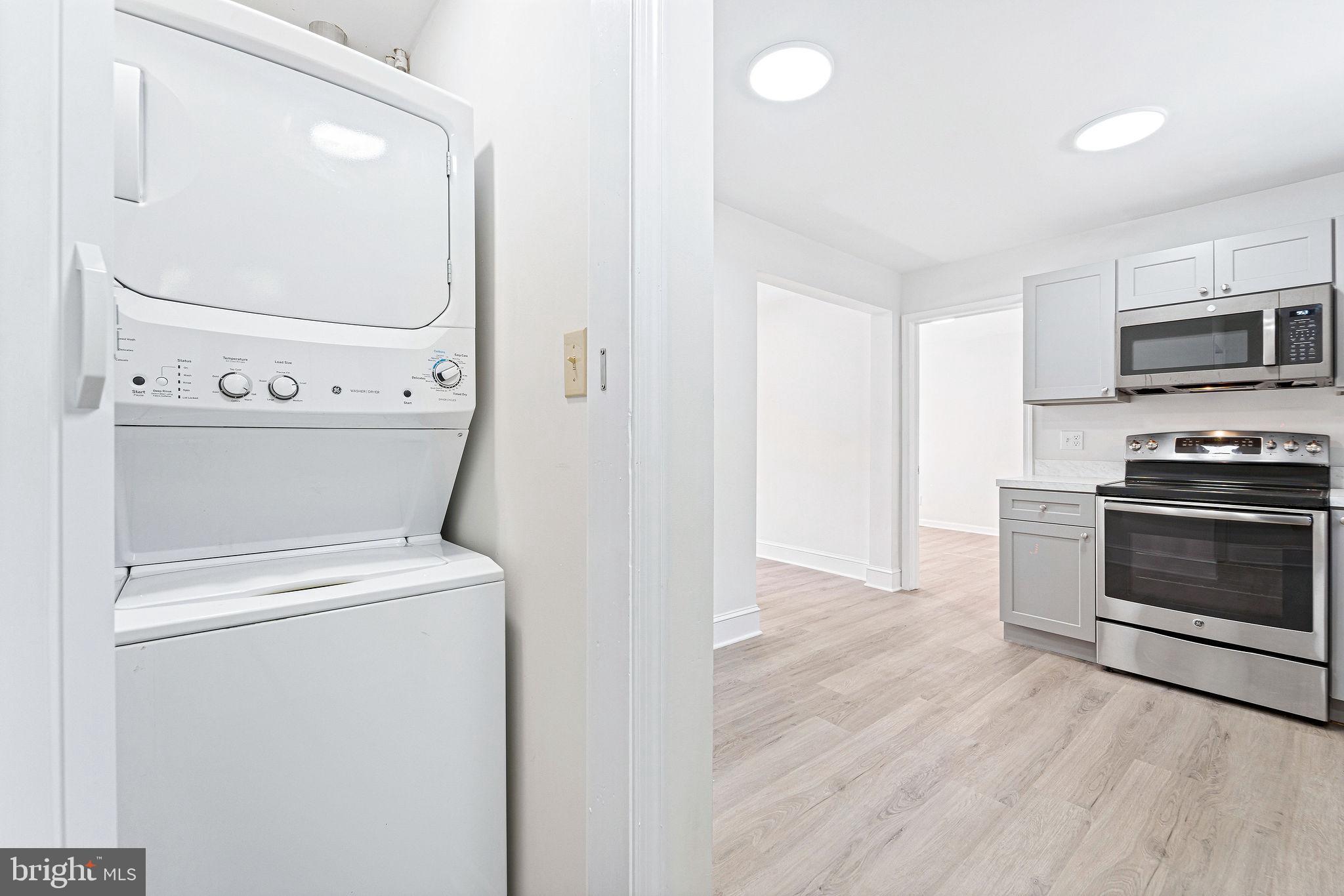 115 Chestnut Street Salem, NJ 08079 - Photo 14 of 34 a view of washer and dryer with wooden floor