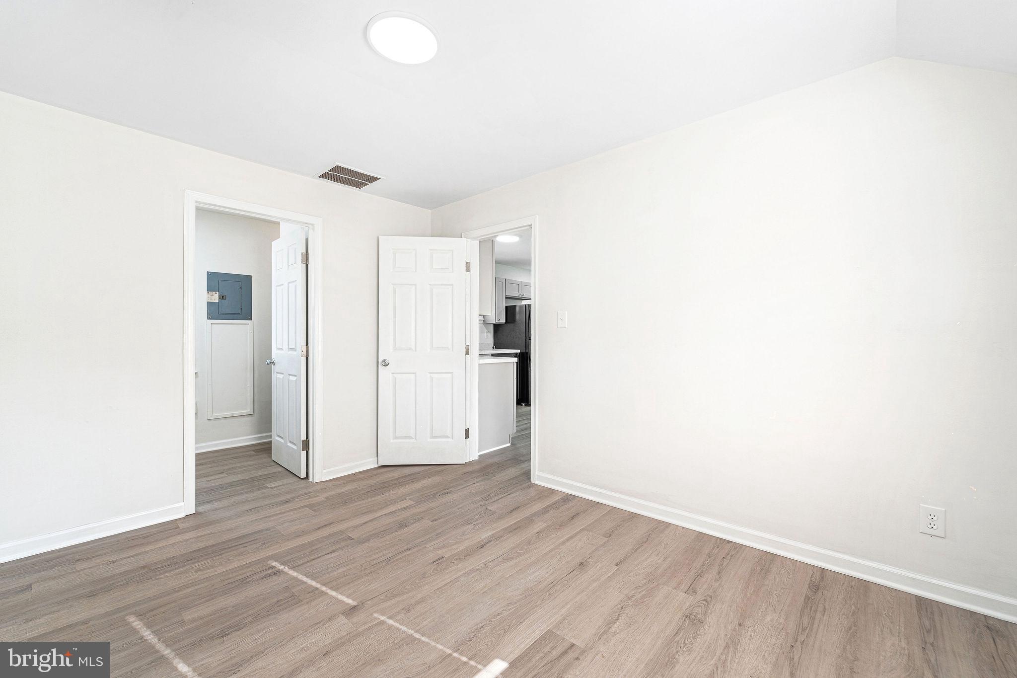 115 Chestnut Street Salem, NJ 08079 - Photo 6 of 34 a view of an empty room with wooden floor and closet
