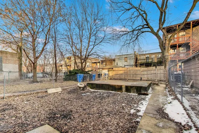 a view of a large building with a large tree