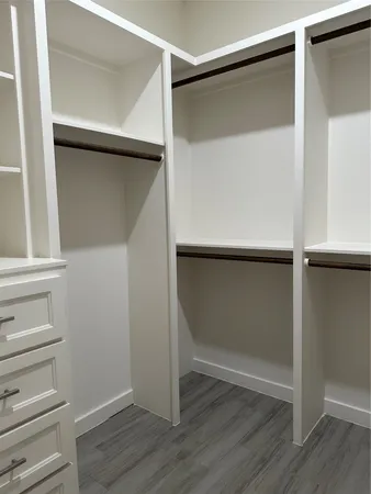 a view of an empty walk in closet