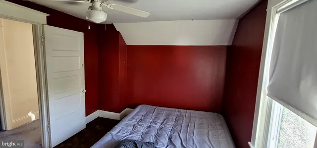 a bathroom with a sink a toilet and window