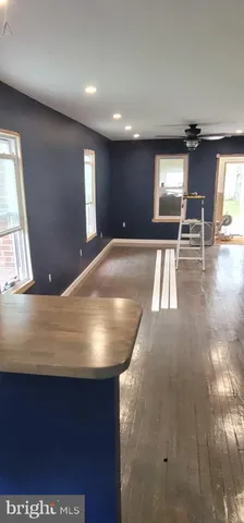 a view of kitchen and dining room with wooden floor