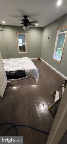 a kitchen with stainless steel appliances a stove a sink a refrigerator and wooden cabinets