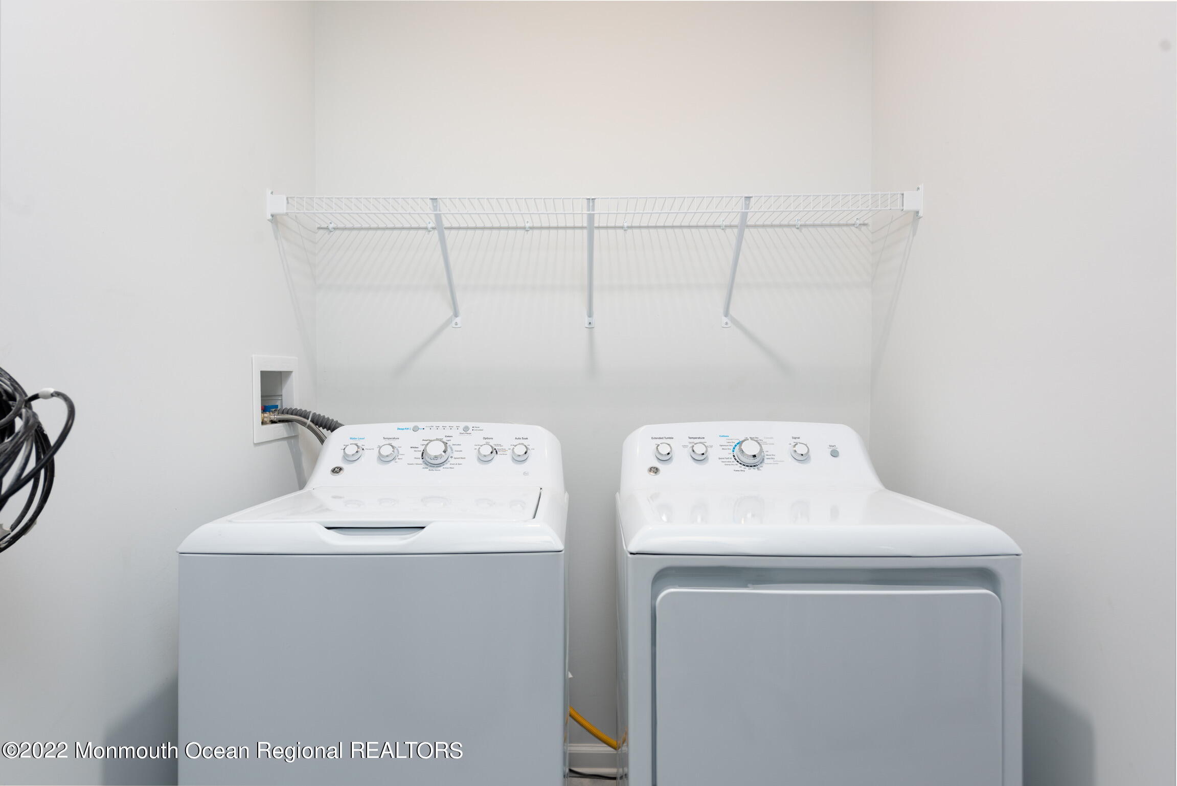 24 Mechanic Street, Unit 407 Red Bank, NJ 07701 - Photo 6 of 17 a utility room with dryer and washer